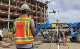 conducting an aerial survey of construction site